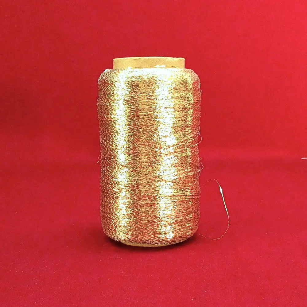 Used Spool Of Gold Yarn On Spindle 1